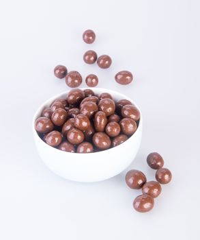 chocolate balls. chocolate balls in bowl on a background.