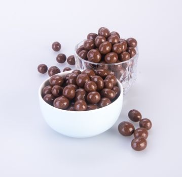 chocolate balls. chocolate balls in bowl on a background.