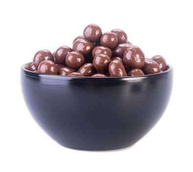 chocolate balls. chocolate balls in bowl on a background.