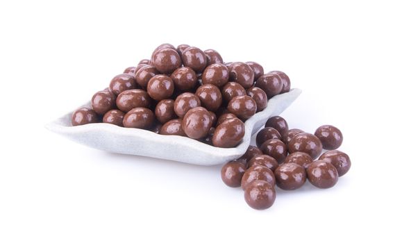 chocolate balls. chocolate balls in bowl on a background.