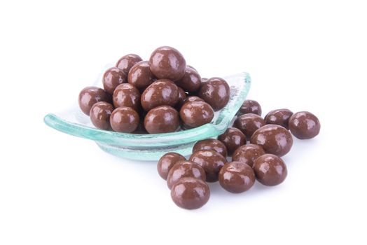 chocolate balls. chocolate balls in bowl on a background.