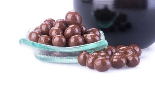 chocolate balls. chocolate balls in bowl on a background.