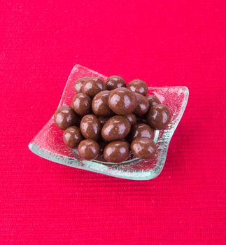 chocolate balls. chocolate balls in bowl on a background.