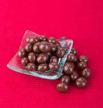 chocolate balls. chocolate balls in bowl on a background.