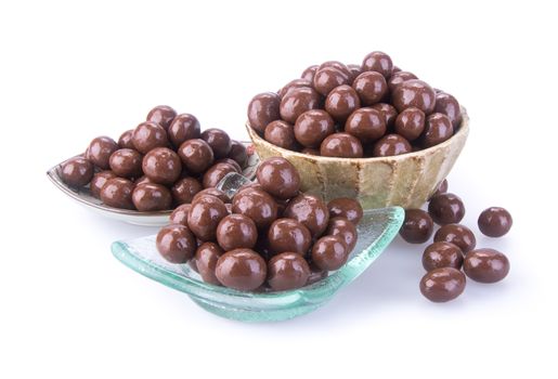 chocolate balls. chocolate balls in bowl on a background.