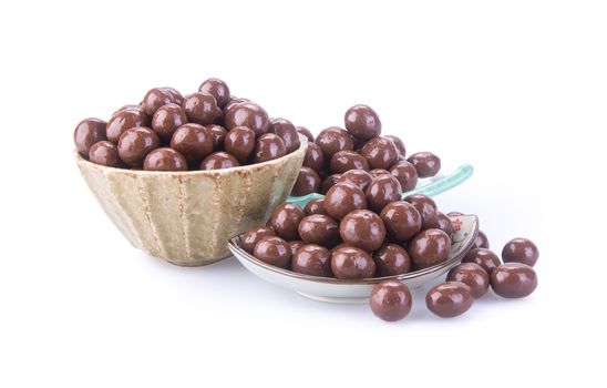 chocolate balls. chocolate balls in bowl on a background.