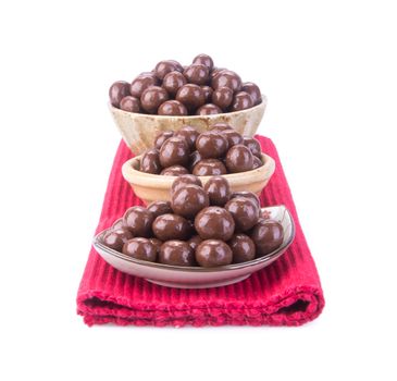 chocolate balls. chocolate balls in bowl on a background.