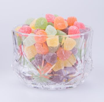 candies. jelly candies in glass bowl on a background.