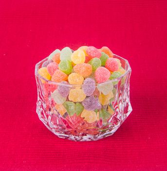 candies. jelly candies in glass bowl on a background.