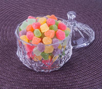 candies. jelly candies in glass bowl on a background.