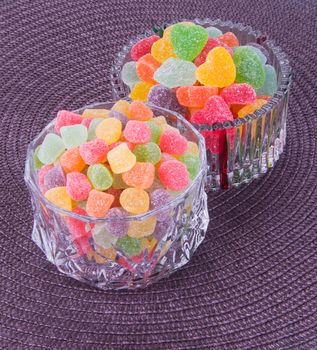 candies. jelly candies in glass bowl on a background.