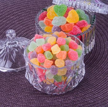 candies. jelly candies in glass bowl on a background.