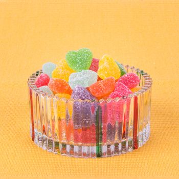 candies. jelly candies in glass bowl on a background.