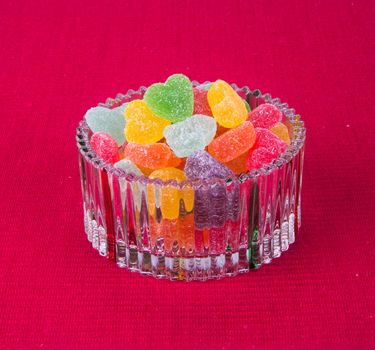 candies. jelly candies in glass bowl on a background.