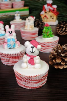 Sugar Christmas bear figurine on glazed muffin