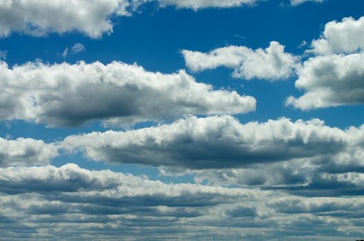 Floating in Blue Sky Fluffy White and Grey Clouds Outdoors