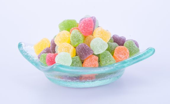 candies. jelly candies in glass bowl on a background.