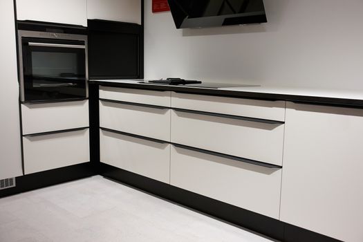 Modern trendy design wooden black and white kitchen                               
