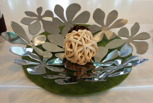 Ornaments on the dining table made of metal with a glossy color.                               