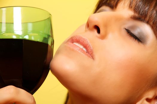 Closeup portrait of a latin woman holding a wine glass.