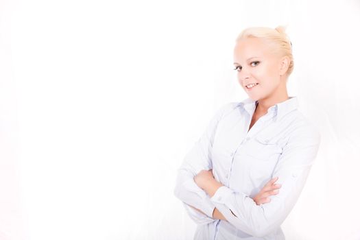 Portrait of a young blonde secretary in a white office.
