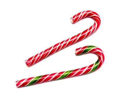 Mint hard candy cane striped in Christmas colours isolated on a white background. Closeup.