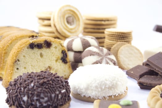 collection of delicious candies, biscuit and Cookies on a white background .