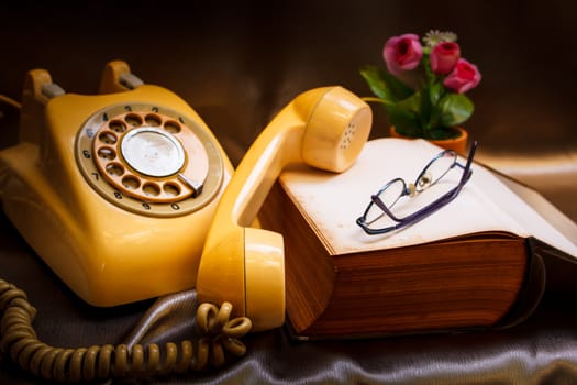 retro phone and book in vintage style.