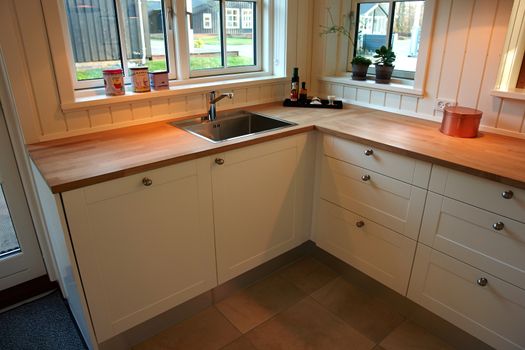 Modern design trendy kitchen with white and wood elements