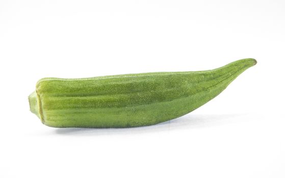 Pile of fresh green okra on white background.