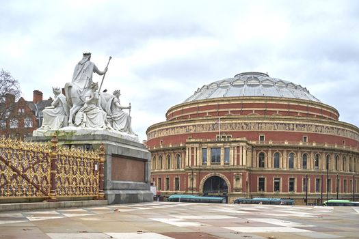 LONDON, UK - DECEMBER 17: Detail of Albert Memorial statue looking at Royal Albert Hall in the background, in Kensington Gardens. December 17, 2014 in London.