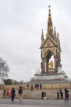 LONDON, UK - DECEMBER 17: Tourists taking pictures in front of the Albert Memorial in Kensington Gardens. December 17, 2014 in London.