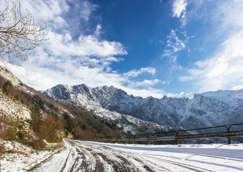 The first snow of the Apuan Alps whitening white marble quarries