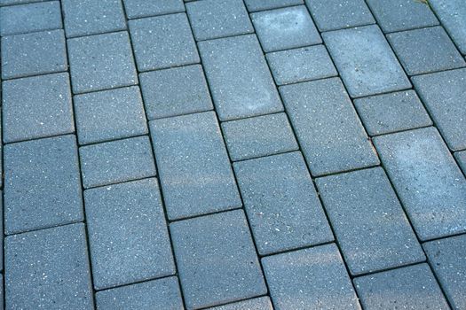 Details of dark gray crafted stone garden tiles floor                               