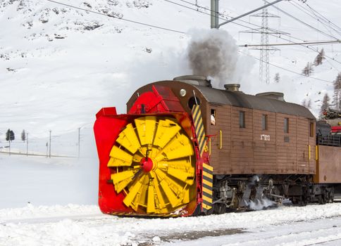 Snowplow steam, along the line of bernina in Swiss