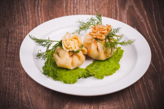 eastern european stuffed pancakes served on white plate