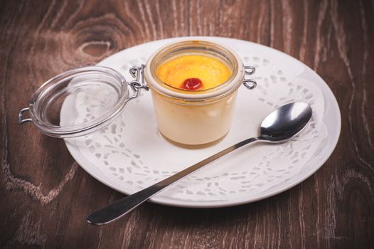 sweet creme brulee in jar with spoon 