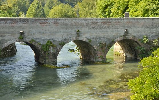 Bridge over the river Mincio, in Borguetto, an ancient village  in the municipality of Valeggio, in the province of Verona, Italy.