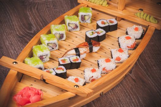 sushi roll set served on boat plate 