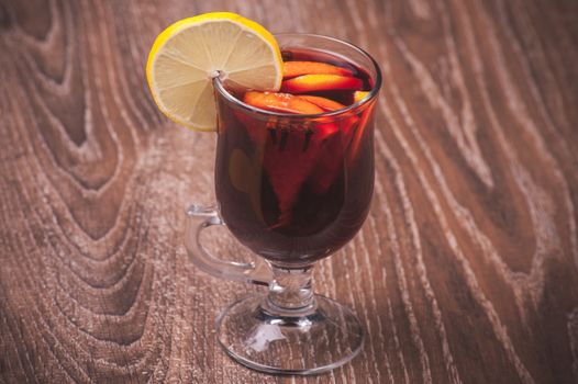 red mulled wine in glass with orange