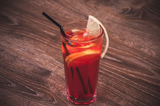 cold ice tea in glass with lemon 