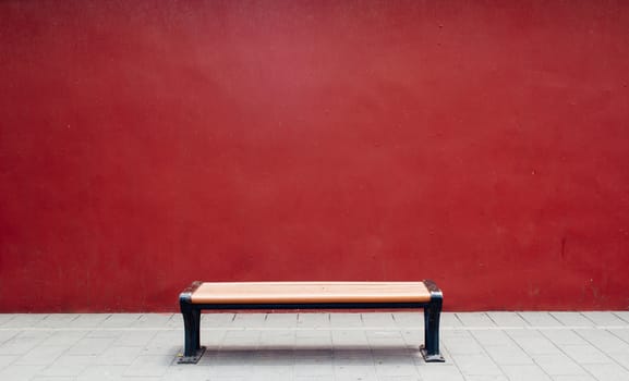Bench in The Forbidden City with red wall