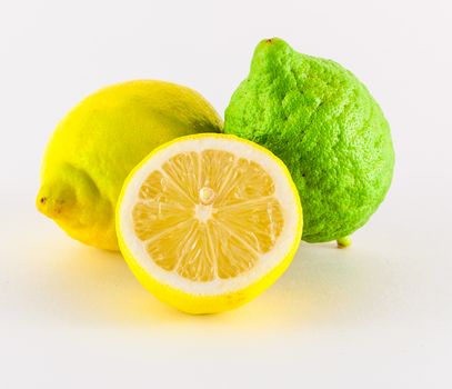 Fresh lemons yellow and green on white background