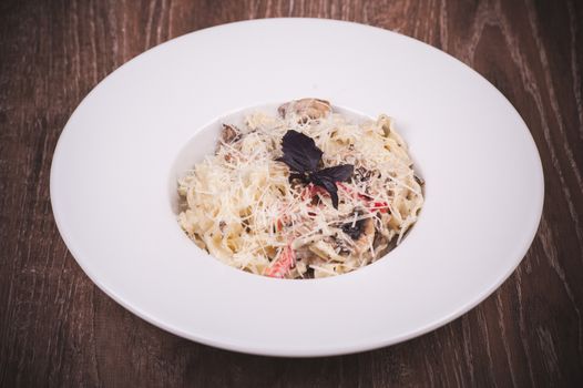 pasta with creamy mushroom sauce on white plate 