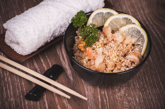 seafood fried rice in bowl with chopsticks 