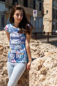 Girl standing in Sicily near the street