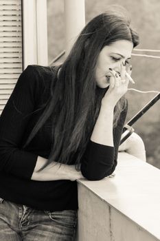 True sicilian Smoking woman in a terrace