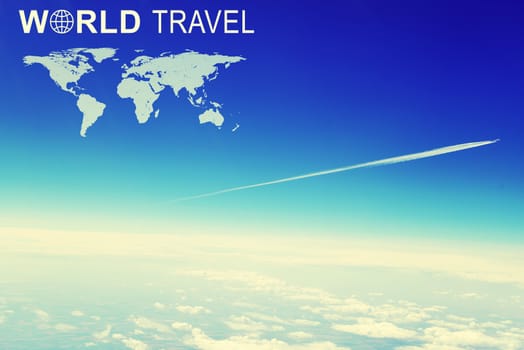 Distant jet airliner with vapour trail against sky and clouds, aerial view. Inscription World Travel, related symbol and contoured map of world continents
