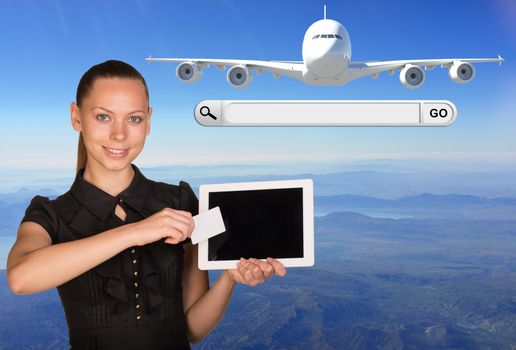 Beautiful businesswoman holding blank tablet PC and blank business card in front of PC screen.Beside are jet airplane and search bar with Go button