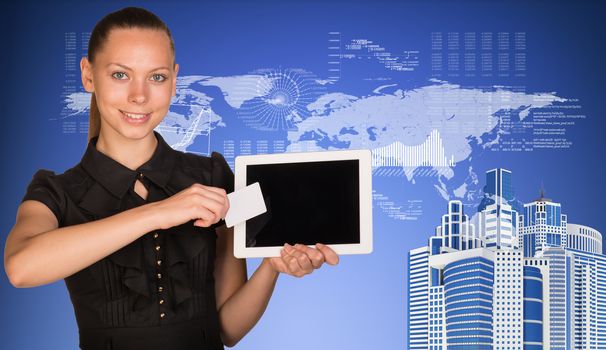 Beautiful businesswoman holding blank tablet PC and blank business card in front of PC screen. Skyscrapers, world map, hi-tech graphs with various data as backdrop